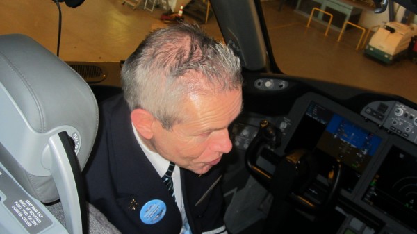 Captain André Berger in his front left seat