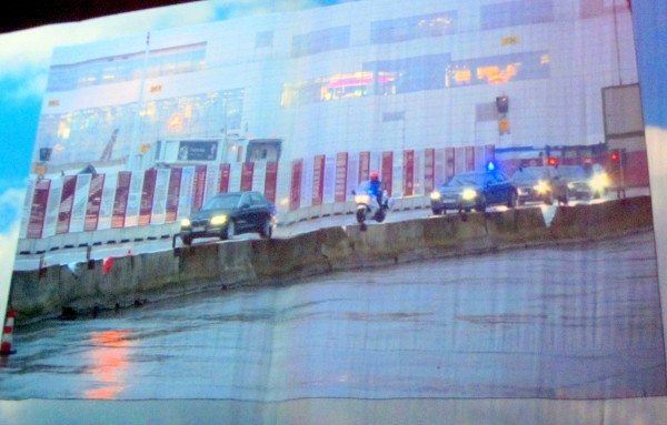 Beamers on the curtains showing the arrival of the Royal motorcade on the tarmac