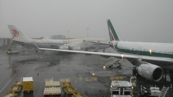 AZ A330 in the front (one of two parked at the gates ; this one going to MXP, the second one to FCO).