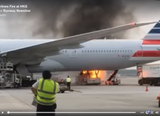 Cargo loader bursts into flames as they are loading an American Airlines Boeing 777 at Hong Kong Airport