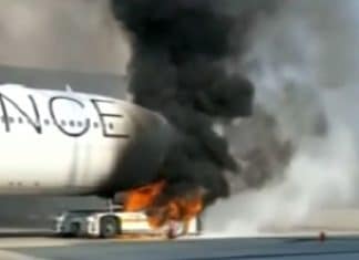 Tow truck under Lufthansa A340-300 Star Alliance livery catches fire at Frankfurt Airport