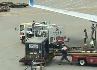 Hong Kong Airport worker literally throws cargo shipment in luggage cart