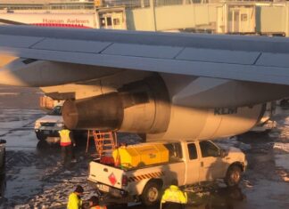 KLM Boeing 747-400 touches parked service truck at Toronto Pearson Airport, Canada