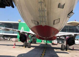 Air India Airbus A321 meets jeep on runway during take-off roll; early rotation and tail scrape
