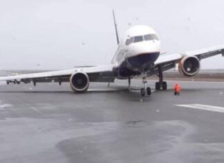 Icelandair Boeing 757 suffers main gear collapse after landing at very stormy Keflavik Airport, Iceland