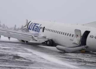 UTair Boeing 737-500 slides to a stop on its engines and belly during landing at Usinsk Airport, Russia