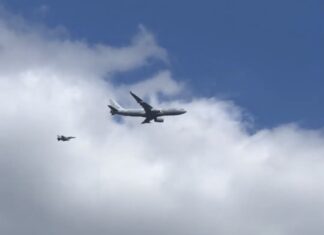 NATO multi-national Airbus A330 MRTT escorted by two F-16s of the Belgian Air Force