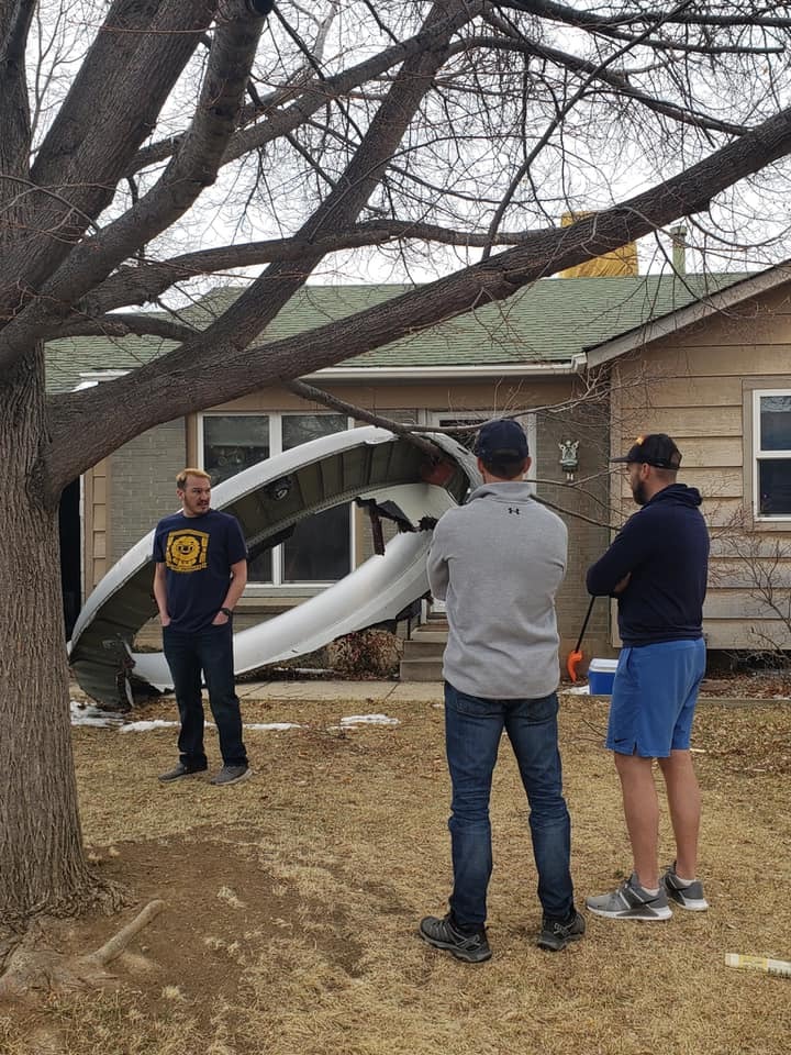 Giant metal engine part of the United Airlines Boeing 777 lands in a person’s garden in Colorado after the explosion