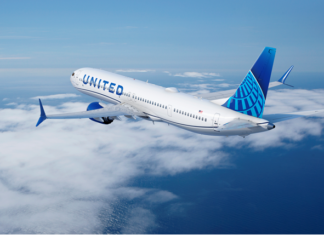 United flight diverts after passenger allegedly tries to open door mid-flight