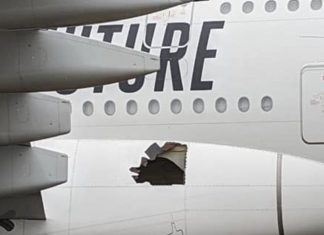 Emirates Airbus A380 lands at Brisbane airport with damaged fuselage