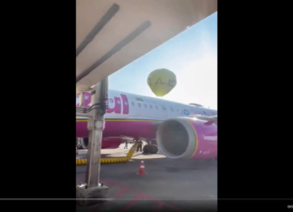 Fireworks balloon lands against parked Azul Brazilian Airlines Airbus at Rio de Janeiro’s Santos Dumont Airport