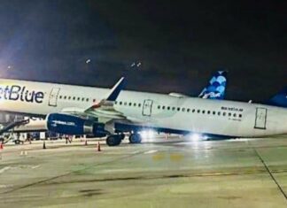 JetBlue Airbus A321 tail tips during unloading at New York JFK