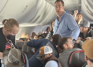 American Airlines flight returns to Albuquerque Airport after passenger attempts to open emergency exit