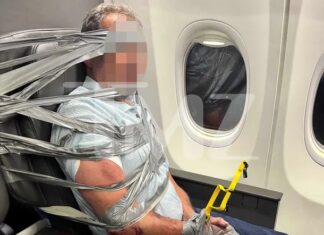 American Airlines flight diverted after passenger is duct-taped and zip-tied to his seat
